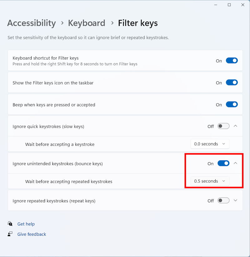 Use the toggle switch to enable Ignore unintended keystrokes. Click the down arrow to set your own delay time.